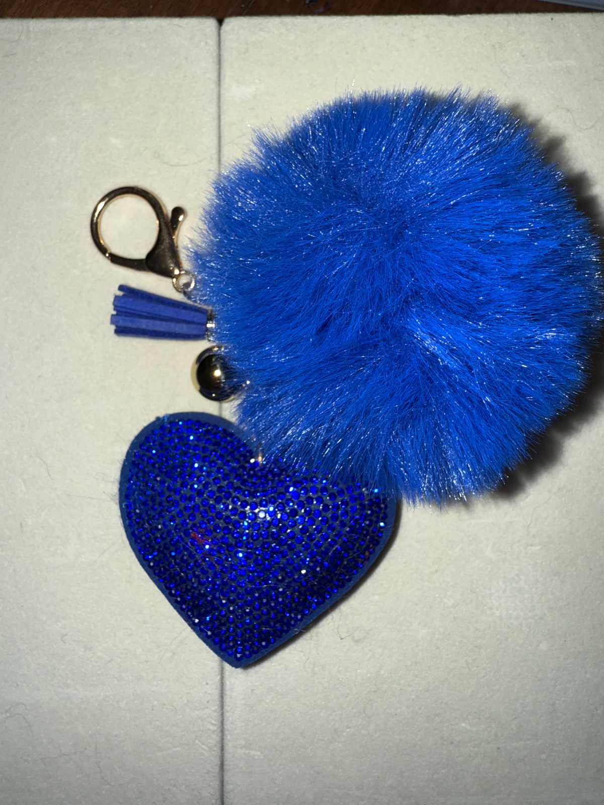 Fuzz ball with rhinestone heart
