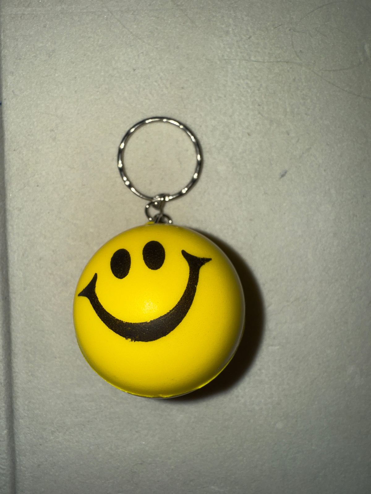 Smiley face foam ball keychain